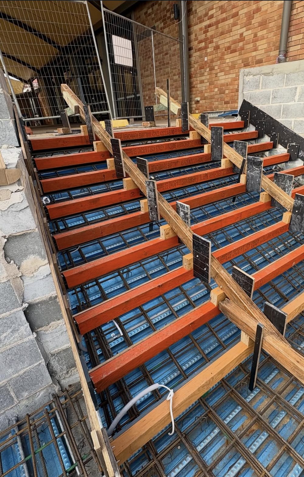 Reinforcement fitted around a formed concrete stair